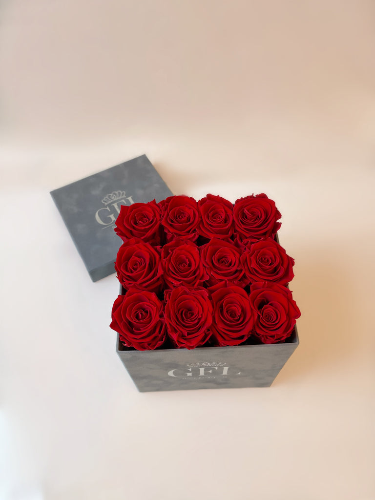 Vibrant red preserved eternity forever roses in velvet suede box. real roses that last a year.