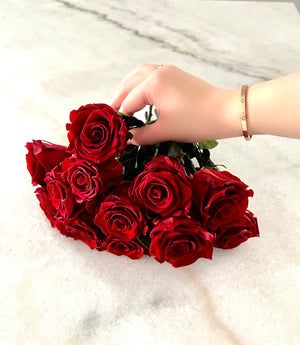 Open image in slideshow, A bouquet of burgundy red preserved eternity roses, each with deep, velvety petals in a rich, elegant shade. The roses maintain their vibrant color and natural texture, creating a sophisticated and lasting arrangement that symbolizes timeless beauty and love.
